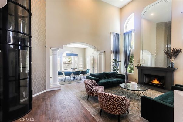 Dining room, Fireplace, Interior, Living room, Recessed Lighting, Wood Texture Flooring