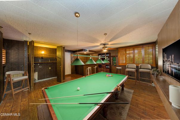 Billiard Table, Game Room, Interior, Pendant Lights, Stone Walls, Wood Texture Flooring