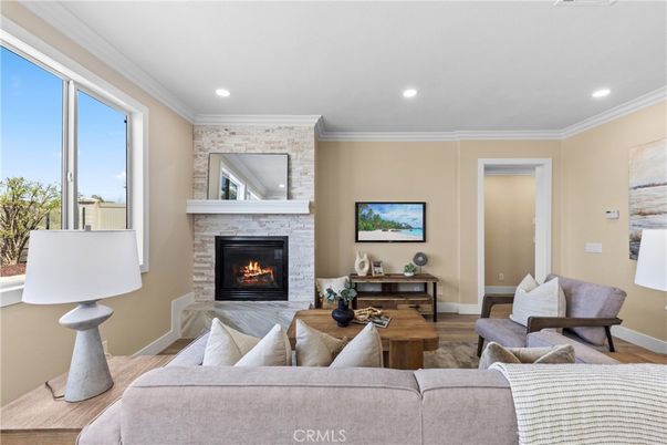 Fireplace, Interior, Living room, Recessed Lighting, Stone Walls, Wood Texture Flooring
