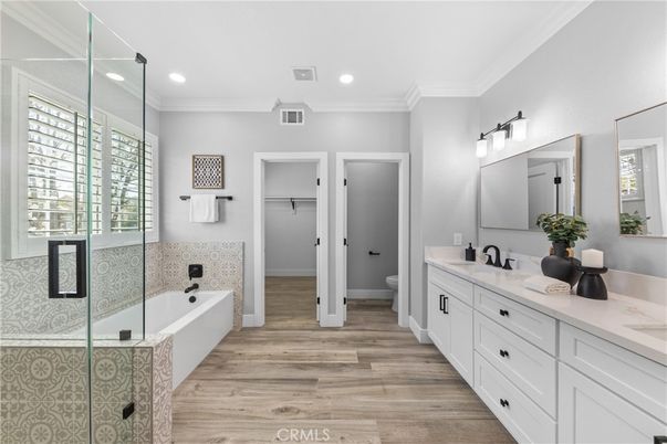Bathroom, Dual Sink Vanities, Glass Shower, Interior, Recessed Lighting, Wood Texture Flooring