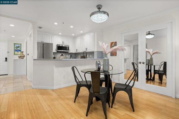 Chandelier, Dining room, Interior, Kitchen, Recessed Lighting, Stainless Steel Appliances, Wood Texture Flooring