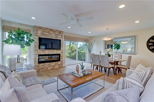 Dining room, Fireplace, Interior, Living room, Pendant Lights, Recessed Lighting, Stone Walls, Wood Texture Flooring