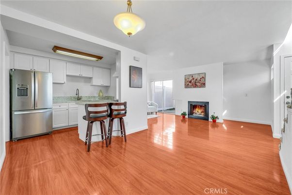 Fireplace, Interior, Kitchen, Stainless Steel Appliances, Wood Texture Flooring