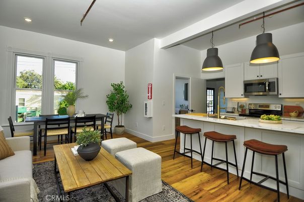 Dining room, Interior, Kitchen, Pendant Lights, Recessed Lighting, Stainless Steel Appliances, Wood Texture Flooring