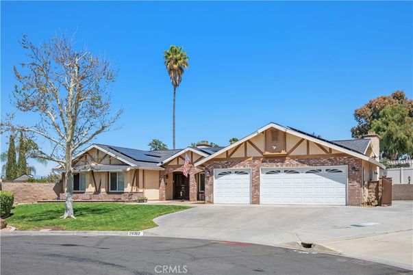 Attached, Exterior, Facade, Brick Facade, Solar Panels, Tudor Revival