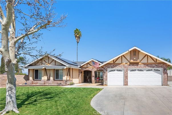 Attached, Exterior, Facade, Brick Facade, Solar Panels, Tudor Revival