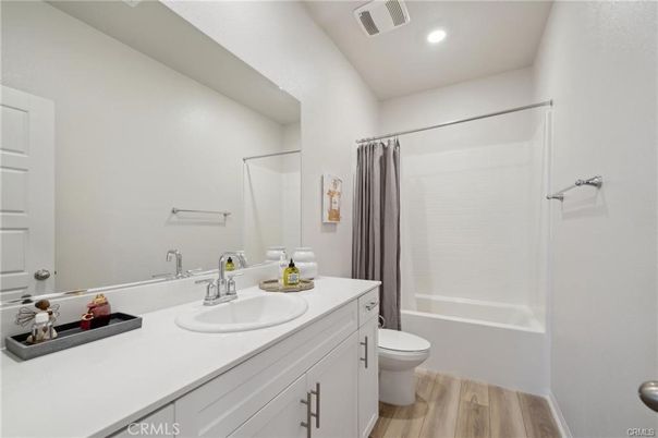 Bathroom, Dual Sink Vanities, Interior, Recessed Lighting, Wood Texture Flooring