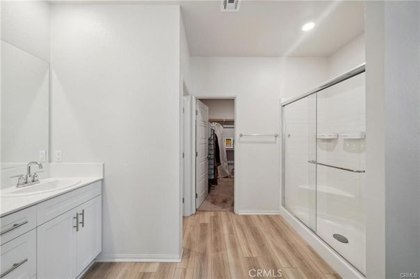 Bathroom, Glass Shower, Interior, Recessed Lighting, Walk-in Closets, Wood Texture Flooring