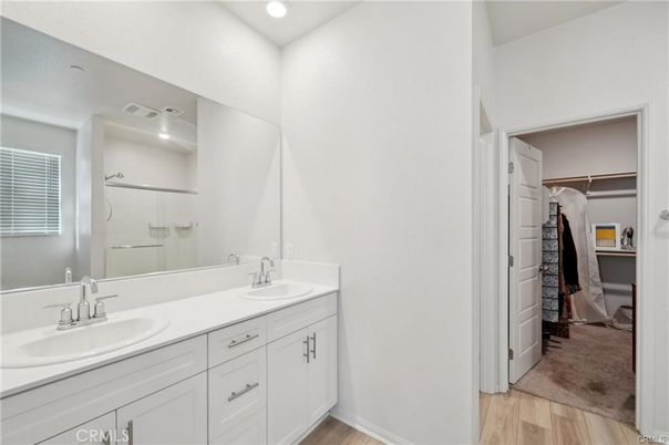 Bathroom, Dual Sink Vanities, Interior, Recessed Lighting, Walk-in Closets, Wood Texture Flooring