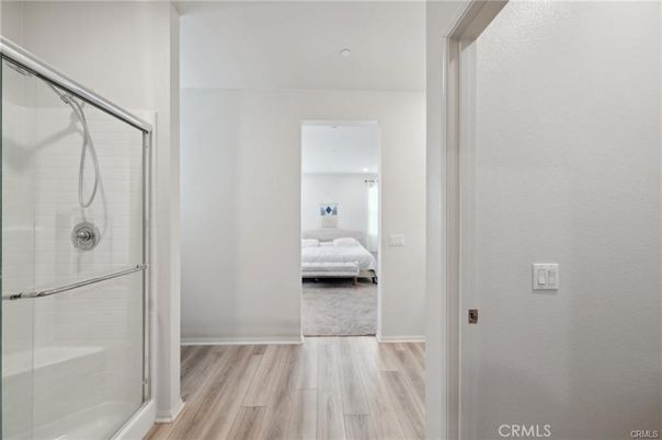 Bathroom, Bedroom, Glass Shower, Interior, Recessed Lighting, Wood Texture Flooring