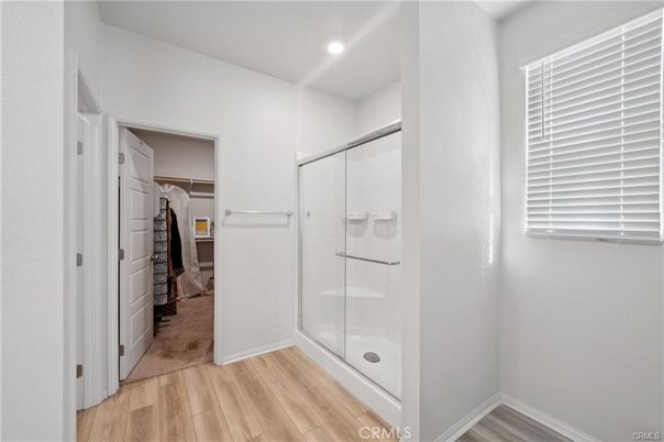 Bathroom, Glass Shower, Interior, Recessed Lighting, Walk-in Closets, Wood Texture Flooring