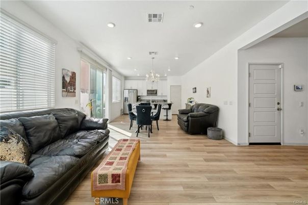 Chandelier, Dining room, Interior, Kitchen, Living room, Pendant Lights, Recessed Lighting, Wood Texture Flooring