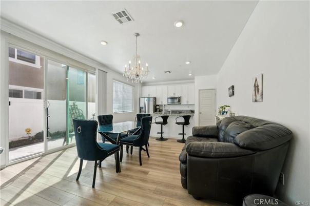 Chandelier, Dining room, Interior, Kitchen, Living room, Recessed Lighting, Stainless Steel Appliances, Wood Texture Flooring