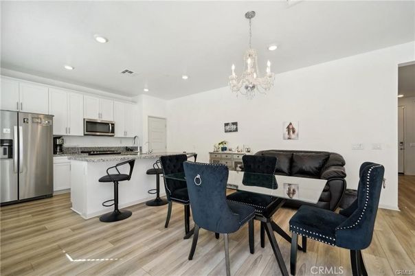 Chandelier, Dining room, Interior, Kitchen, Recessed Lighting, Stainless Steel Appliances, Wood Texture Flooring