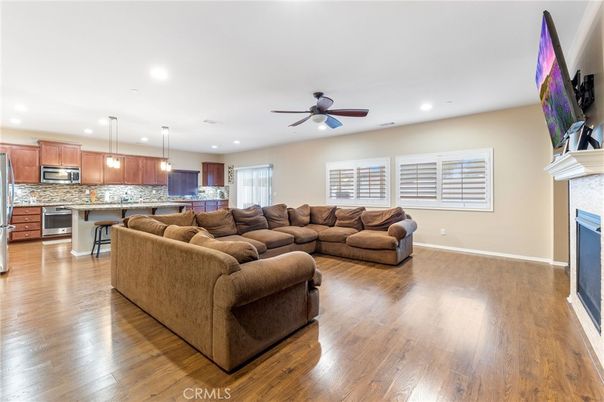 Fireplace, Interior, Kitchen, Living room, Pendant Lights, Recessed Lighting, Stainless Steel Appliances, Wood Texture Flooring