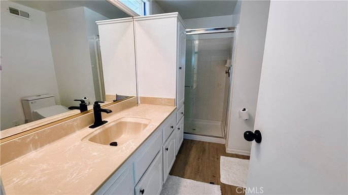 Bathroom, Dual Sink Vanities, Glass Shower, Interior, Wood Texture Flooring