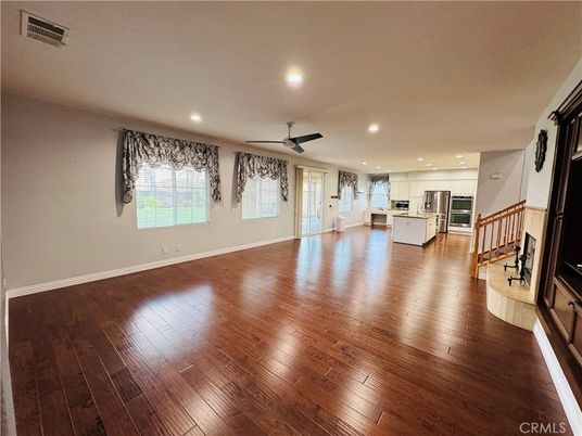 Empty room, Interior, Kitchen, Recessed Lighting, Stainless Steel Appliances, Wood Texture Flooring