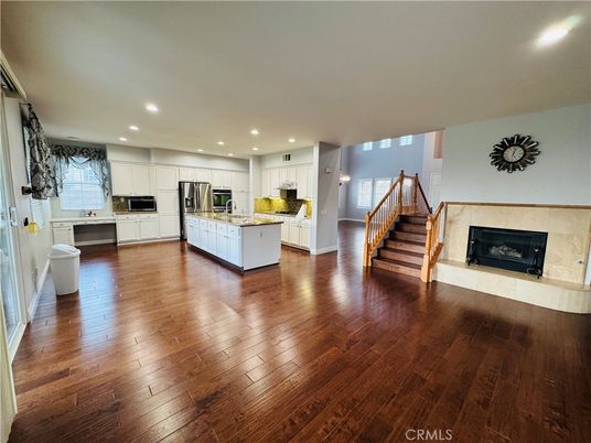Fireplace, Interior, Kitchen, Recessed Lighting, Stainless Steel Appliances, Wood Texture Flooring
