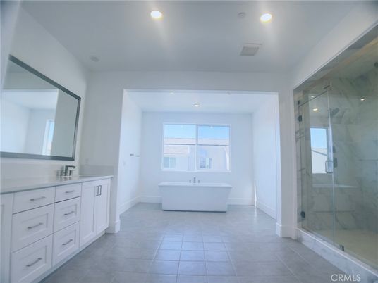 Bathroom, Dual Sink Vanities, Free Standing Baths, Glass Shower, Interior, Marble Walls, Recessed Lighting