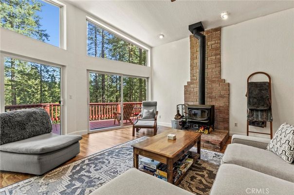 Fireplace, Interior, Living room, Recessed Lighting, Stone Walls, Wood Texture Flooring