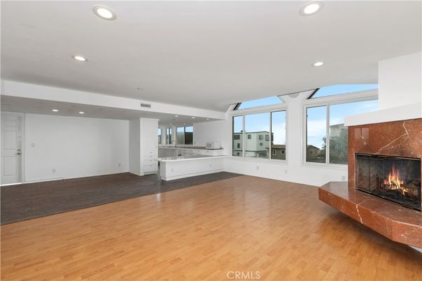 Empty room, Fireplace, Interior, Kitchen, Recessed Lighting, Wood Texture Flooring