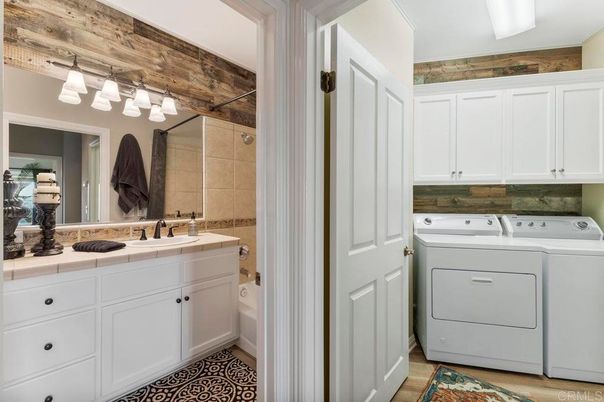 Bathroom, Interior, Tile Countertops, Utility Closets, Washer, Wood Texture Flooring