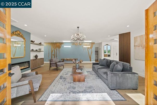 Chandelier, Fireplace, Interior, Living room, Recessed Lighting, Wood Texture Flooring