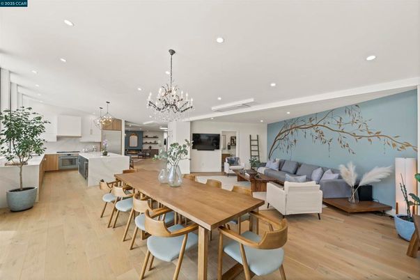 Chandelier, Dining room, Interior, Kitchen, Living room, Pendant Lights, Recessed Lighting, Stainless Steel Appliances, Wood Texture Flooring
