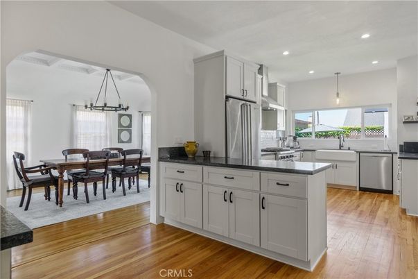Dining room, Interior, Kitchen, Pendant Lights, Recessed Lighting, Stainless Steel Appliances, Wood Texture Flooring