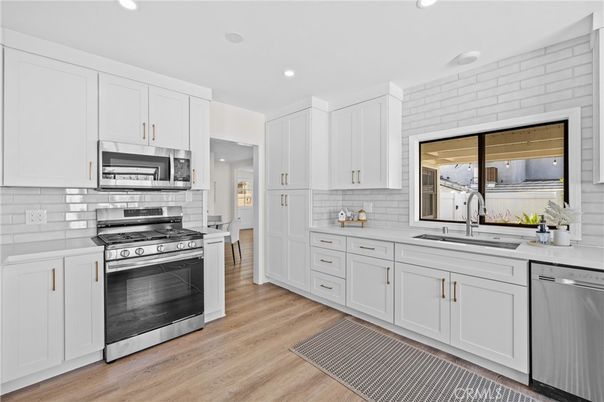 Interior, Kitchen, Recessed Lighting, Stainless Steel Appliances, Wood Texture Flooring