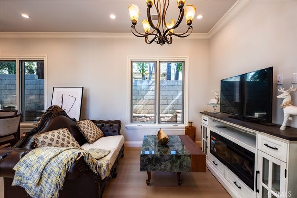Chandelier, Fireplace, Interior, Living room, Recessed Lighting, Wood Texture Flooring