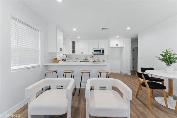 Dining room, Interior, Kitchen, Recessed Lighting, Stainless Steel Appliances, Wood Texture Flooring