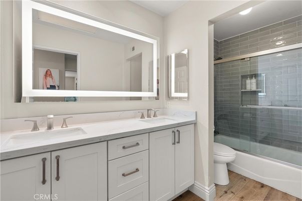 Bathroom, Dual Sink Vanities, Glass Shower, Interior, Wood Texture Flooring