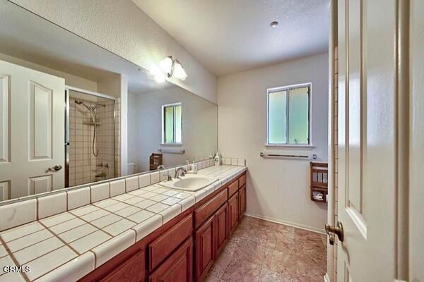 Bathroom, Dual Sink Vanities, Glass Shower, Interior, Recessed Lighting, Tile Countertops