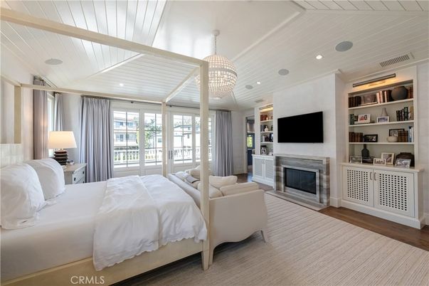 Bedroom, Chandelier, Fireplace, Interior, Recessed Lighting, Wood Texture Flooring