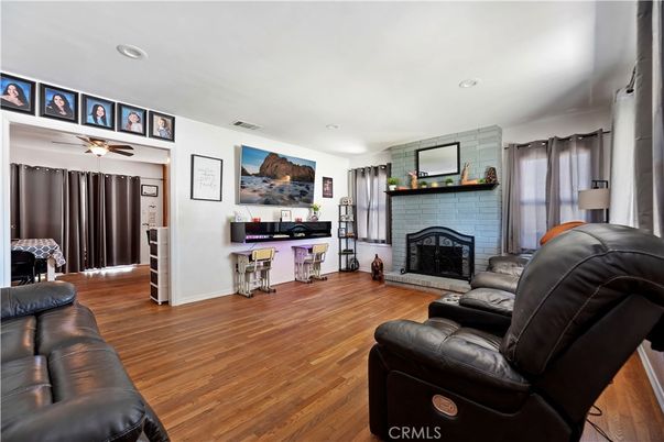 Fireplace, Interior, Living room, Recessed Lighting, Stone Walls, Wood Texture Flooring