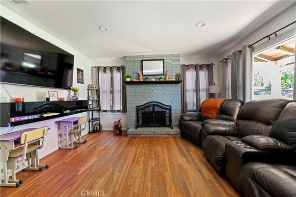 Fireplace, Interior, Living room, Recessed Lighting, Stone Walls, Wood Texture Flooring