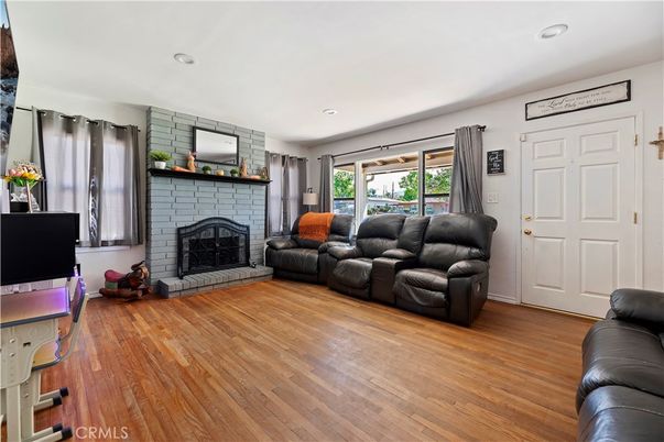 Fireplace, Interior, Living room, Recessed Lighting, Stone Walls, Wood Texture Flooring
