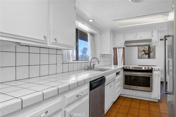 Interior, Kitchen, Recessed Lighting, Stainless Steel Appliances, Tile Countertops