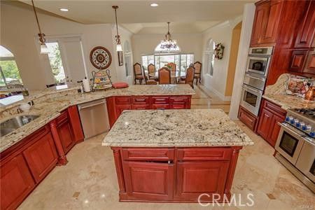 Chandelier, Dining room, Interior, Kitchen, Pendant Lights, Recessed Lighting, Stainless Steel Appliances