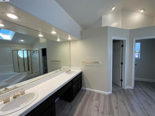 Bathroom, Dual Sink Vanities, Interior, Recessed Lighting, Tile Countertops, Wood Texture Flooring