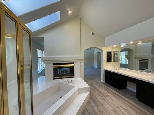Bathroom, Dual Sink Vanities, Fireplace, Interior, Wood Texture Flooring