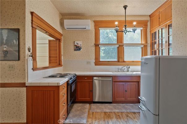 Interior, Kitchen, Pendant Lights, Stainless Steel Appliances, Tile Countertops, Wood Texture Flooring