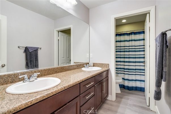 Bathroom, Dual Sink Vanities, Interior, Recessed Lighting, Wood Texture Flooring