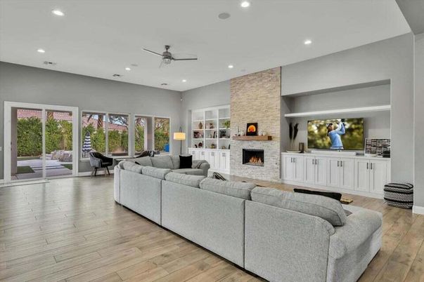 Fireplace, Interior, Living room, Recessed Lighting, Stone Walls, Wood Texture Flooring