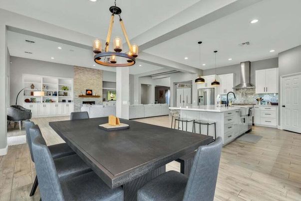 Chandelier, Dining room, Fireplace, Interior, Kitchen, Pendant Lights, Recessed Lighting, Stainless Steel Appliances, Wood Texture Flooring