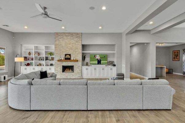Fireplace, Interior, Living room, Recessed Lighting, Stone Walls, Wood Texture Flooring