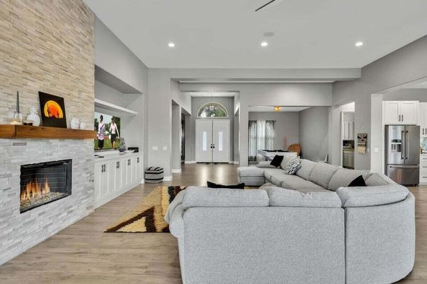 Fireplace, Interior, Kitchen, Living room, Pendant Lights, Recessed Lighting, Stainless Steel Appliances, Stone Walls, Wood Texture Flooring