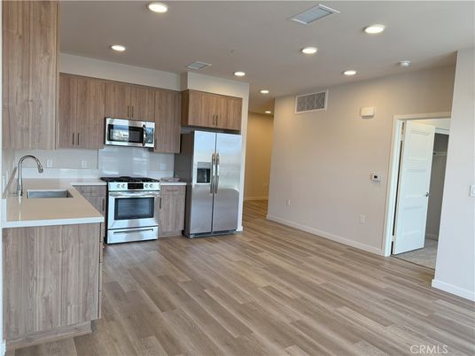 Interior, Kitchen, Recessed Lighting, Stainless Steel Appliances, Wood Texture Flooring