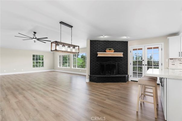 Empty room, Fireplace, Interior, Kitchen, Pendant Lights, Stone Walls, Wood Texture Flooring